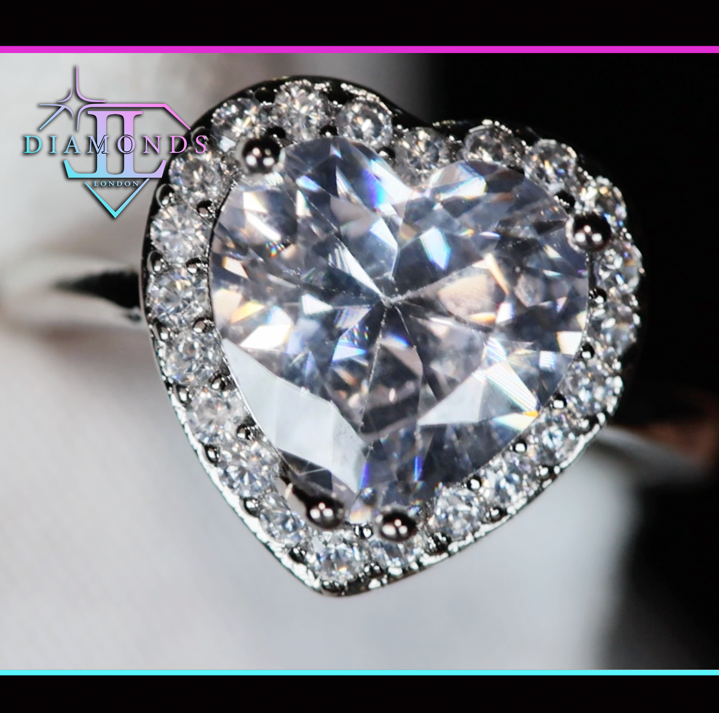 Silver heart cut diamond ring