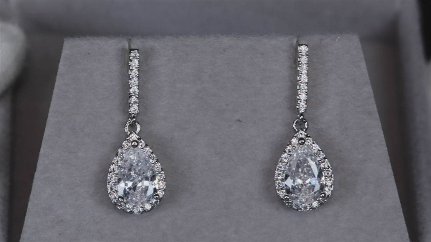 Load and play video in Gallery viewer, Pear Cut Diamond Earrings