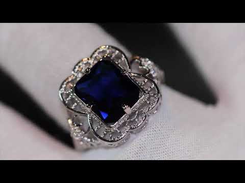Load and play video in Gallery viewer, Womens big blue diamond ring