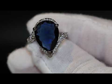 Load and play video in Gallery viewer, Pear cut blue diamond ring