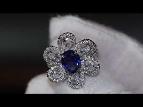 Load and play video in Gallery viewer, Womens blue flower diamond ring