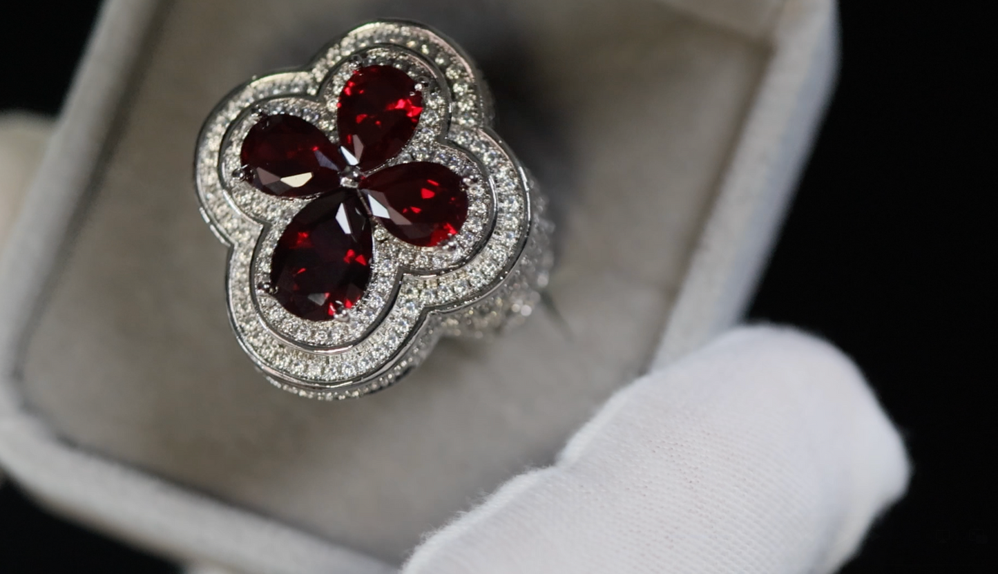 Silver ring with red gemstones