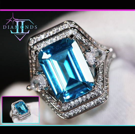 Emerald cut blue diamond ring