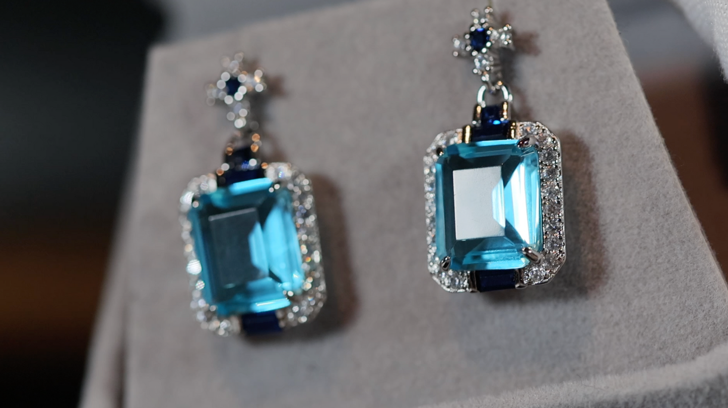 Womens big blue diamond earrings, Blue diamond earrings, Blue emerald cut diamond earrings