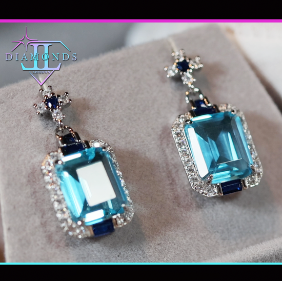 blue emerald cut diamond earrings