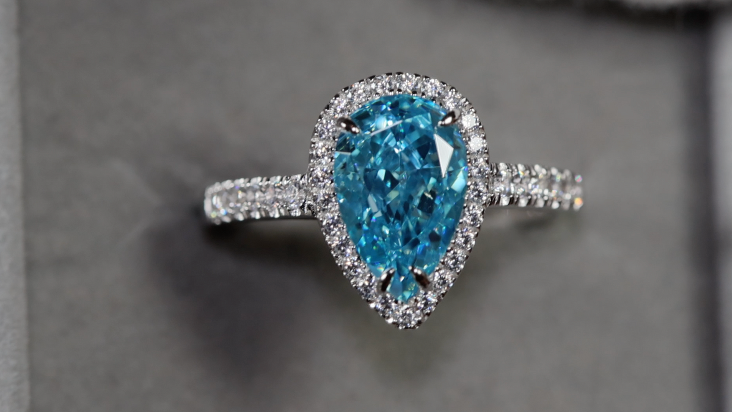 Pear cut blue diamond ring