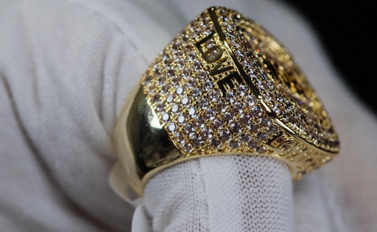 big gold iced out ring