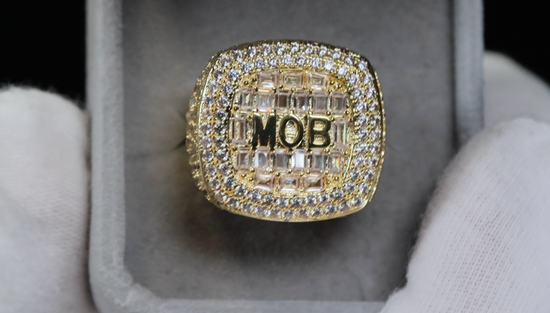 big gold iced out ring