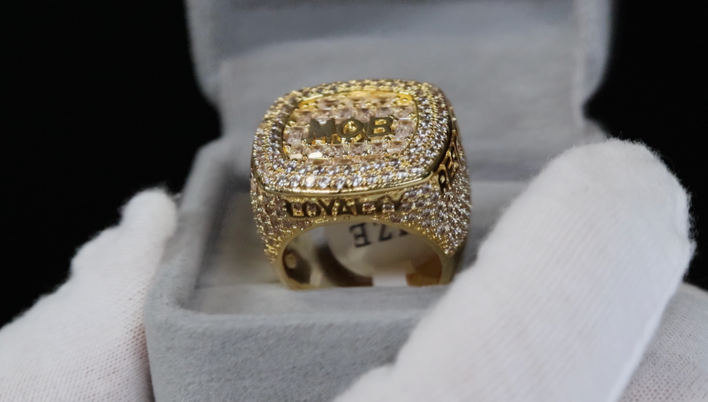 big gold iced out ring