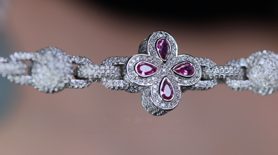 Silver bracelet with pink gemstones