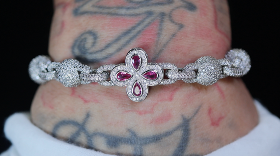 Silver bracelet with red gemstones