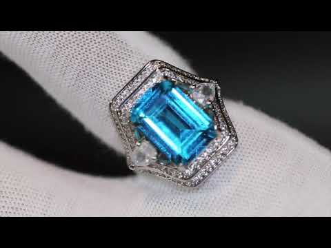 Emerald cut blue diamond ring