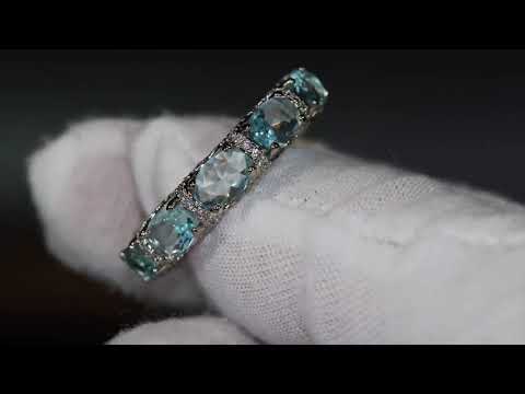 Blue diamond eternity ring