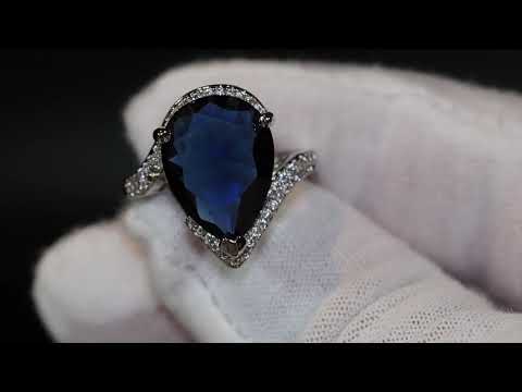 Pear cut blue diamond ring