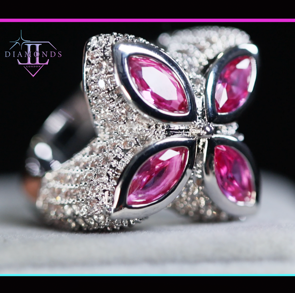 Silver ring with pink gemstones